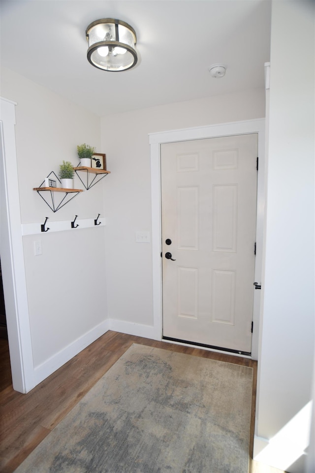 7272 S 7 Mile Rd, Freeland, MI 48623 - doorway to outside featuring wood finished floors and baseboards