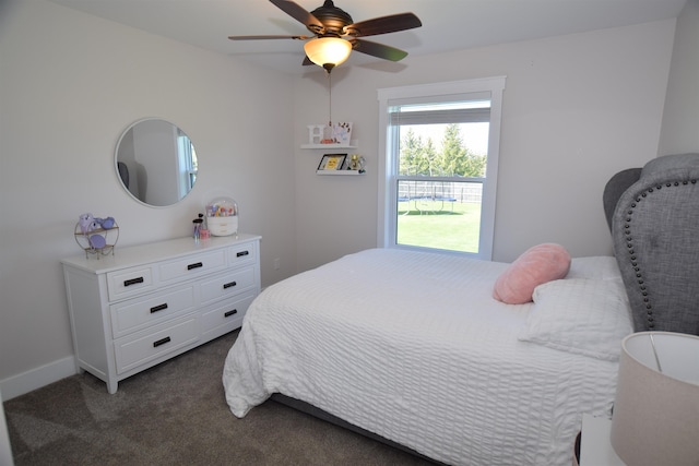 7272 S 7 Mile Rd, Freeland, MI 48623 - bedroom featuring dark colored carpet and a ceiling fan
