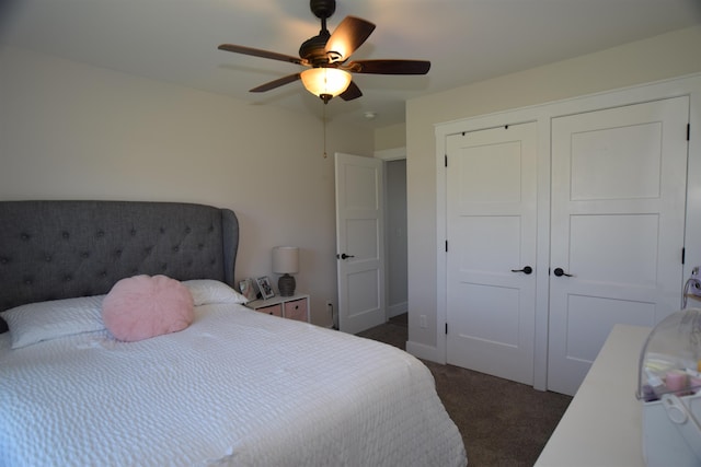7272 S 7 Mile Rd, Freeland, MI 48623 - bedroom featuring dark colored carpet, a closet, and a ceiling fan