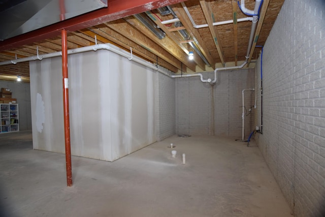 7272 S 7 Mile Rd, Freeland, MI 48623 - unfinished below grade area featuring brick wall
