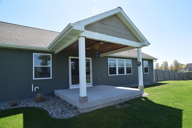 7272 S 7 Mile Rd, Freeland, MI 48623 - back of property with a shingled roof and a patio