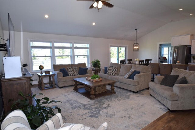 7272 S 7 Mile Rd, Freeland, MI 48623 - living area featuring vaulted ceiling, ceiling fan, wood finished floors, and recessed lighting
