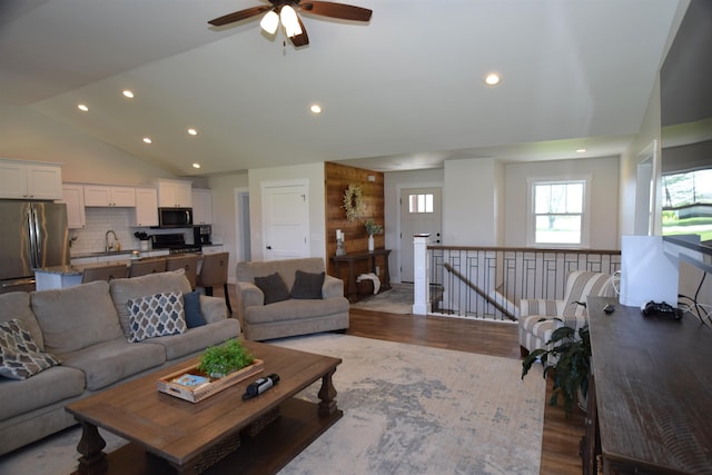 7272 S 7 Mile Rd, Freeland, MI 48623 - living room featuring lofted ceiling, wood finished floors, recessed lighting, and a ceiling fan