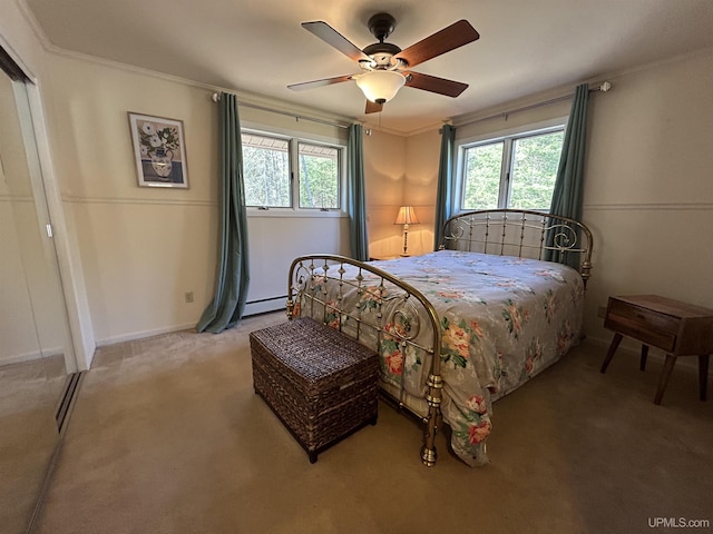 3260 Herron Dr, Gwinn, MI 49841 - carpeted bedroom featuring baseboard heating, ornamental molding, and a ceiling fan