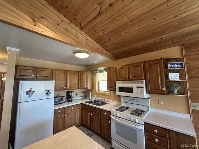 3260 Herron Dr, Gwinn, MI 49841 - kitchen with white appliances, a sink, vaulted ceiling, light countertops, and open shelves