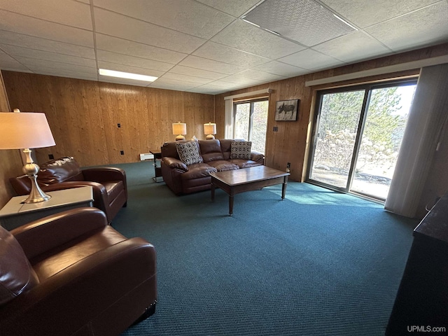 3260 Herron Dr, Gwinn, MI 49841 - carpeted living area with wooden walls and a paneled ceiling