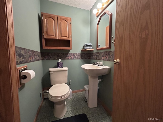 3260 Herron Dr, Gwinn, MI 49841 - bathroom featuring toilet and a textured ceiling