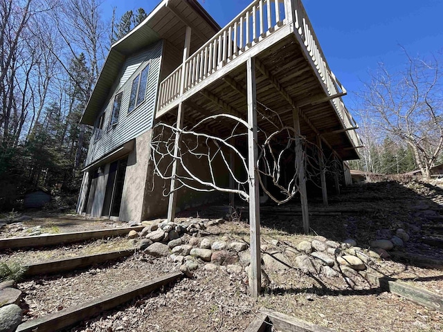 3260 Herron Dr, Gwinn, MI 49841 - view of side of property featuring a wooden deck and a garage