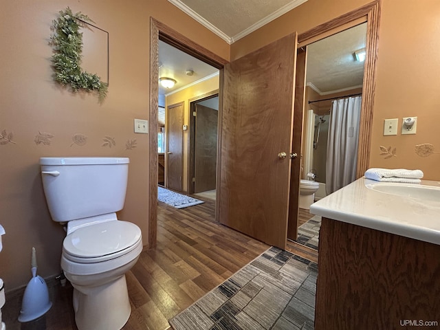 3260 Herron Dr, Gwinn, MI 49841 - full bath with toilet, crown molding, wood finished floors, and vanity