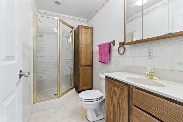 full bath with toilet, a stall shower, vanity, and tile patterned flooring