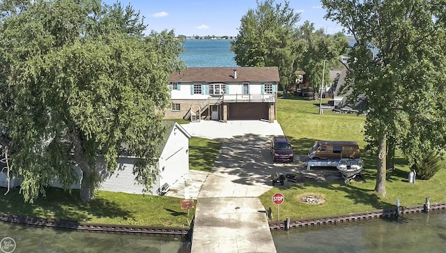 view of subject property with a large body of water