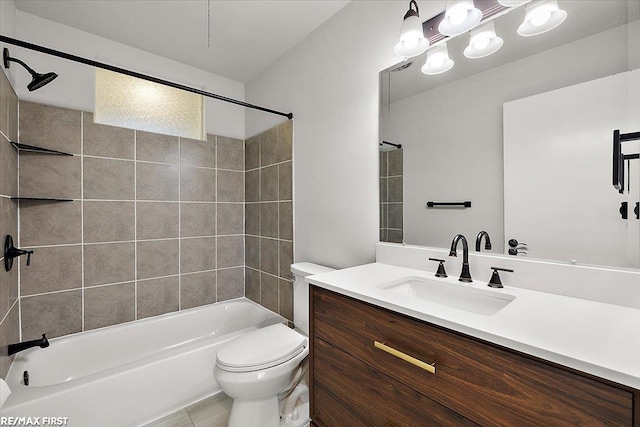 bathroom featuring toilet, tub / shower combination, and vanity