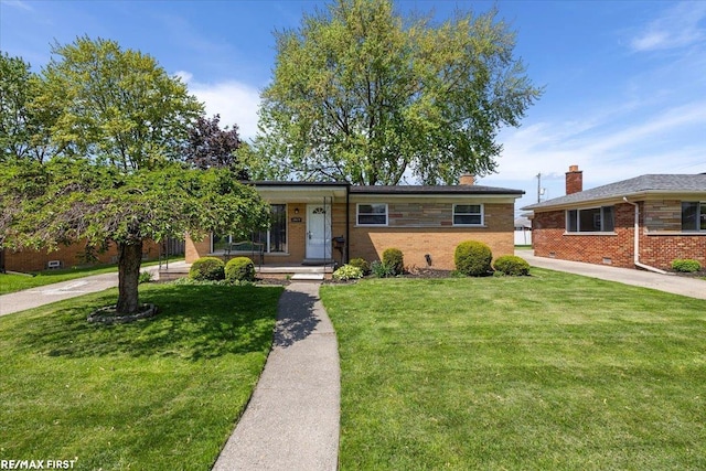single story home with a front lawn and brick siding