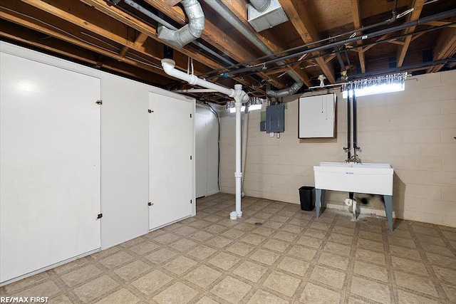 below grade area with light flooring and electric panel