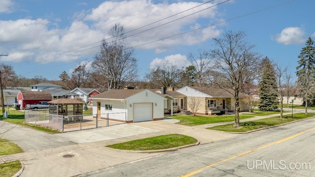 606 S 13th St, Gladstone, MI 49837 - ranch-style home featuring driveway, a garage, and fence