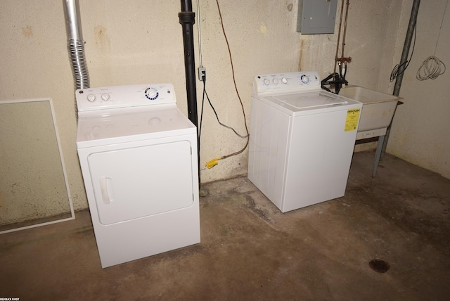 laundry room featuring washing machine and dryer and electric panel
