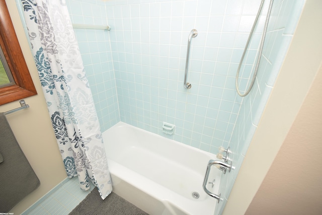 bathroom with shower / bath combo and tile patterned flooring