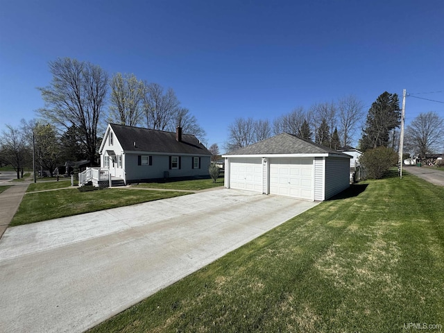 1100 Poplar Ave, Crystal Falls, MI 49920 - view of home's exterior with an outbuilding, a yard, and a garage
