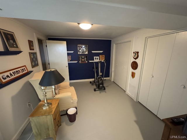 1100 Poplar Ave, Crystal Falls, MI 49920 - living area with baseboards, crown molding, and carpet floors