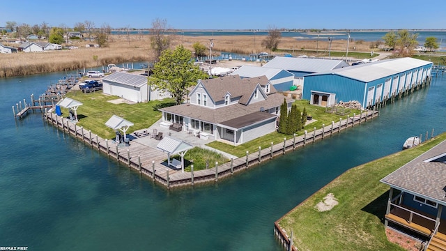 aerial view of property and surrounding area with a large body of water