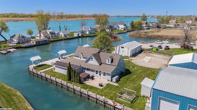 aerial view of residential area with a large body of water