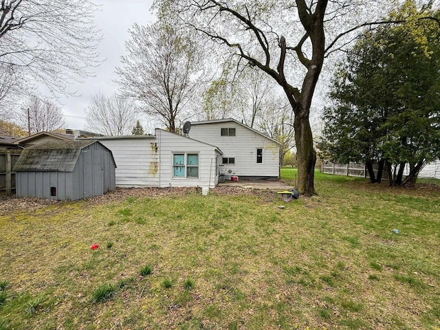 306 N Ionia St, Gladwin, MI 48624 - rear view of house featuring a storage shed and an outdoor structure