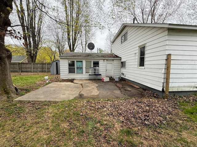 306 N Ionia St, Gladwin, MI 48624 - rear view of property featuring a patio and fence