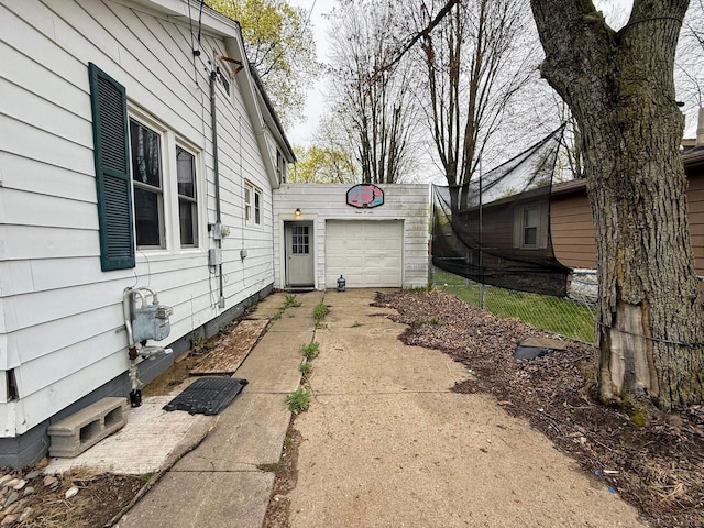 306 N Ionia St, Gladwin, MI 48624 - view of yard featuring driveway and a garage