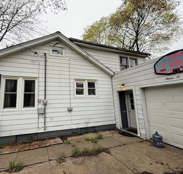 306 N Ionia St, Gladwin, MI 48624 - rear view of house featuring a garage