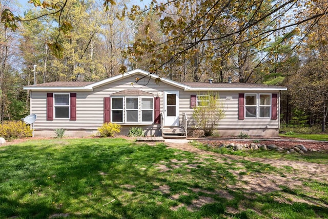 1448 W Sian Dr, Sanford, MI 48657 - manufactured / mobile home featuring crawl space, a front lawn, and roof with shingles