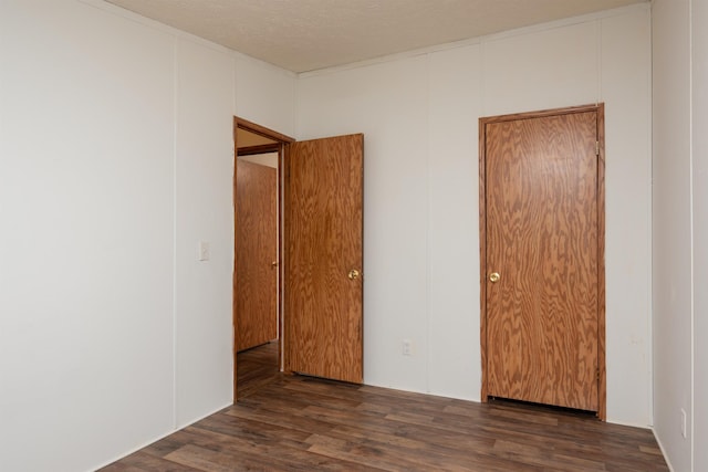 1448 W Sian Dr, Sanford, MI 48657 - unfurnished bedroom with wood finished floors