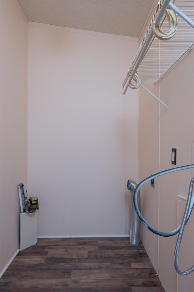 1448 W Sian Dr, Sanford, MI 48657 - washroom featuring wood finished floors and a textured ceiling