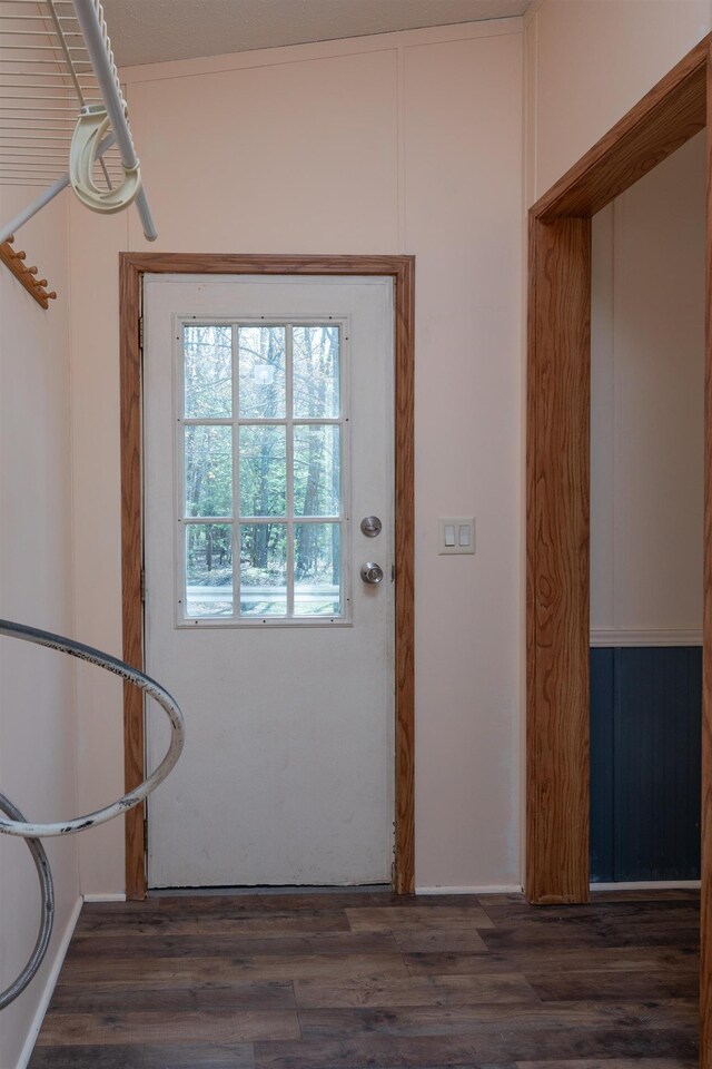 1448 W Sian Dr, Sanford, MI 48657 - doorway with dark wood-style flooring