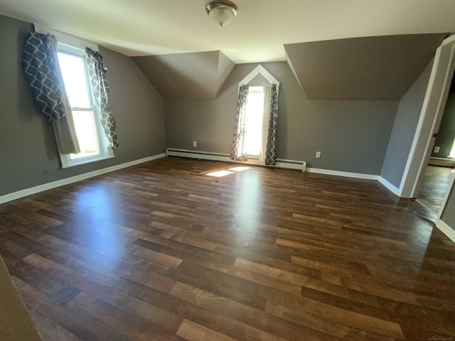6053 Van Dyke Rd, Brown City, MI 48416 - bonus room featuring dark wood-type flooring, lofted ceiling, baseboards, and baseboard heating