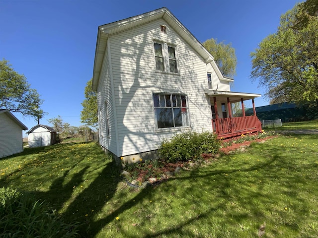 6053 Van Dyke Rd, Brown City, MI 48416 - rear view of house featuring a yard and a porch