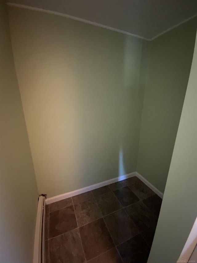 6053 Van Dyke Rd, Brown City, MI 48416 - empty room with a baseboard heating unit and baseboards