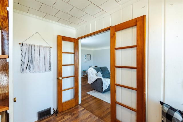 410 E Nicol Rd, Sandusky, MI 48471 - doorway to outside with dark wood finished floors and ornamental molding