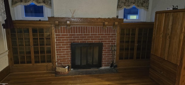 15611 Charles R Ave, Eastpointe, MI 48021 - detailed view of wood finished floors and a brick fireplace
