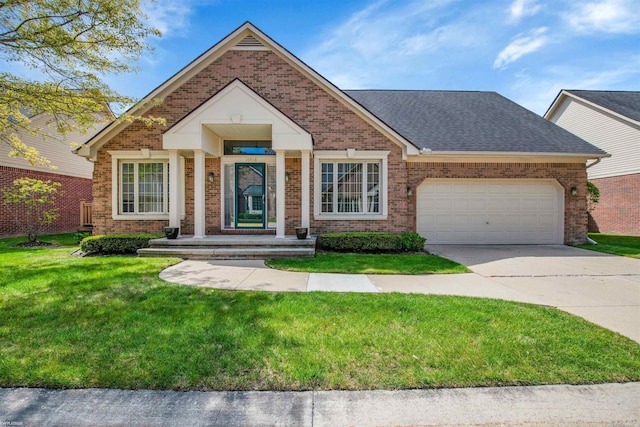 view of front of home featuring brick siding, an attached garage, concrete driveway, a front yard, and roof with shingles