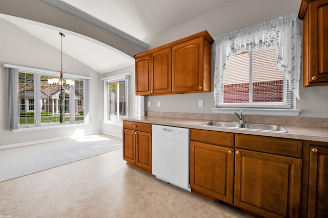 kitchen featuring white dishwasher, a sink, vaulted ceiling, light countertops, and a chandelier