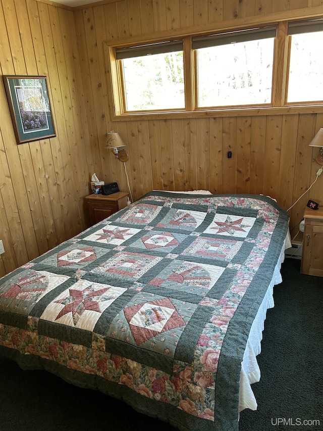 25393 Campsite Dr, Michigamme, MI 49861 - carpeted bedroom featuring multiple windows and wood walls