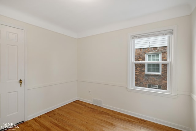 unfurnished room featuring light wood-style flooring and baseboards