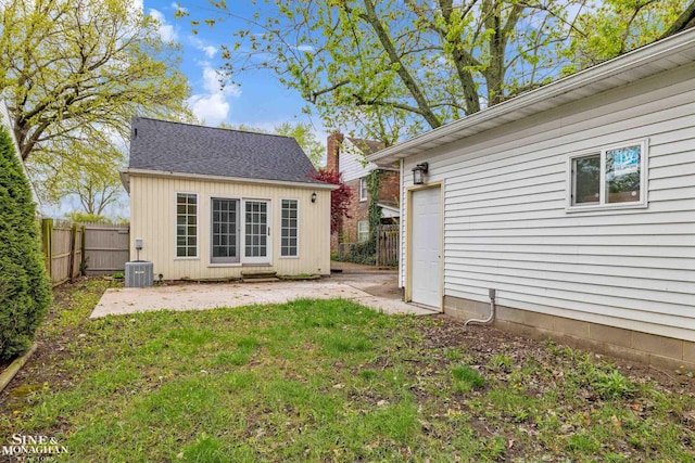 back of house with central AC and a patio