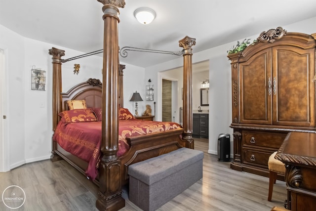 505 N Main St, Yale, MI 48097 - bedroom featuring light wood-style floors and ensuite bath