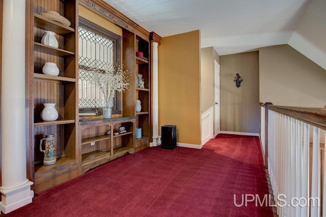 212 S 1st Ave, Escanaba, MI 49829 - additional living space featuring dark carpet, baseboards, and vaulted ceiling