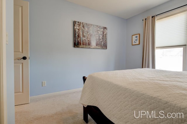 212 S 1st Ave, Escanaba, MI 49829 - bedroom with carpet flooring and baseboards
