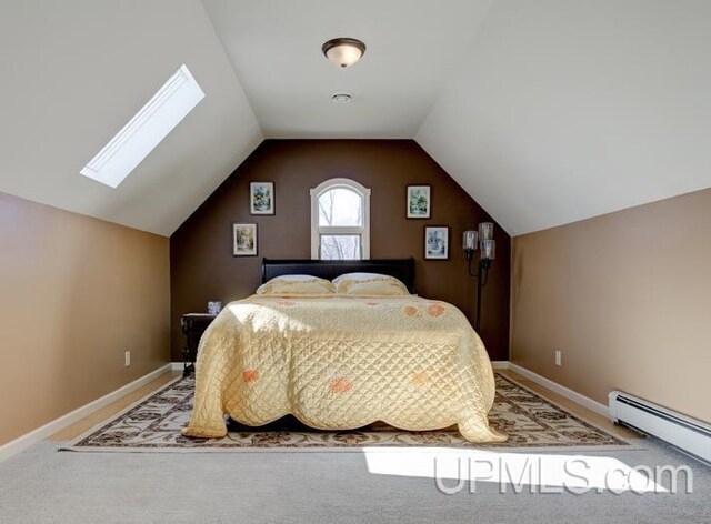212 S 1st Ave, Escanaba, MI 49829 - carpeted bedroom with a baseboard radiator, a skylight, vaulted ceiling, and baseboards