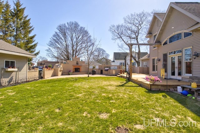 212 S 1st Ave, Escanaba, MI 49829 - view of yard featuring french doors, a patio area, a deck, and a residential view
