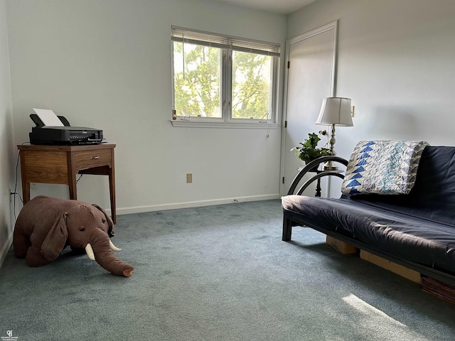 sitting room with carpet flooring and baseboards