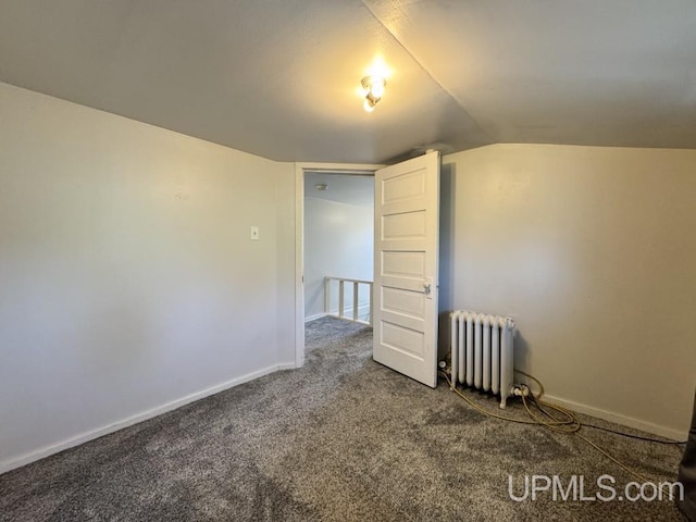 437 N Main St, Lanse, MI 49946 - additional living space featuring radiator heating unit, carpet floors, vaulted ceiling, and baseboards